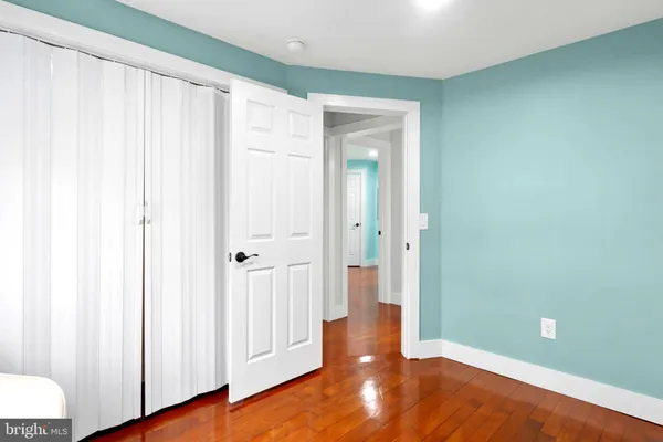 a view of a livingroom with wooden floor