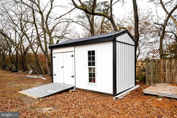 a view of a house with a snow on the road
