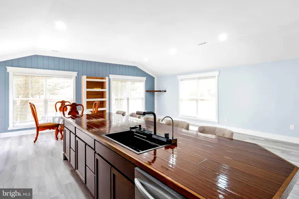 a backyard of a house with large trees