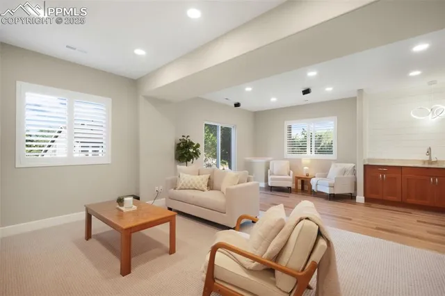 a living room with furniture and a window