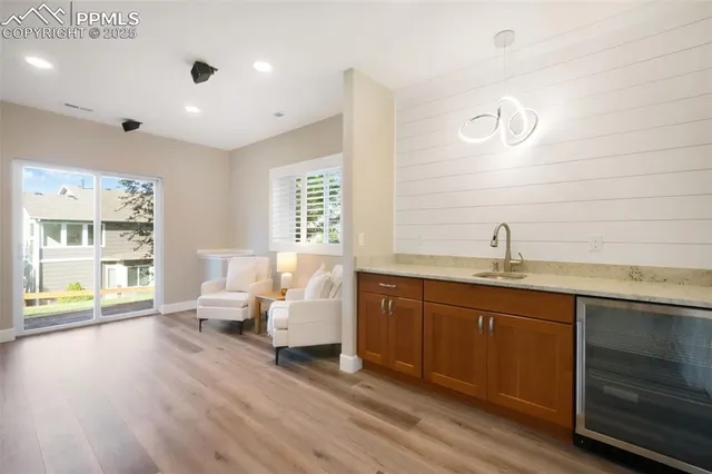 a spacious bathroom with double vanity and a large mirror