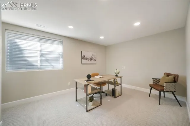 a workspace with furniture and a window