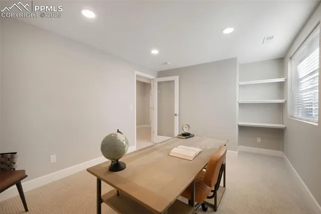 a workspace with furniture and window