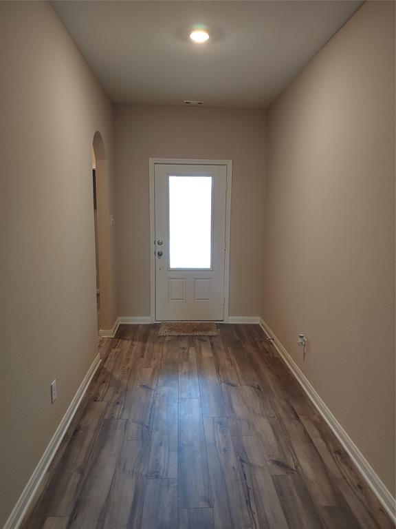 280 Moonstone Way Princeton, TX 75407 - Photo 3 of 17 Doorway to outside with dark wood-type flooring