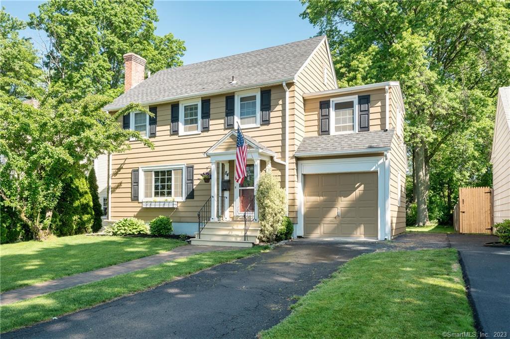 84 Robbins Drive Wethersfield, CT 06109 - Photo 1 of 1 a front view of a house with a yard and trees