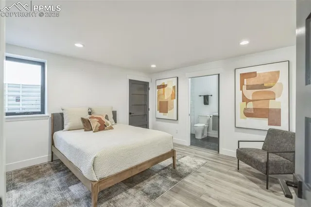 a bedroom with a bed and a couch