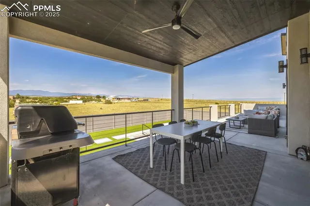 a view of a dining room with furniture and window