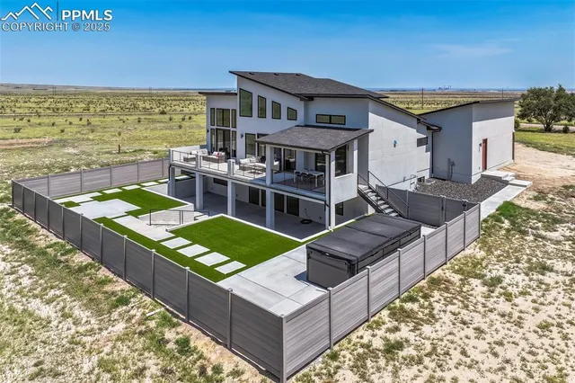 an aerial view of a house with a garden