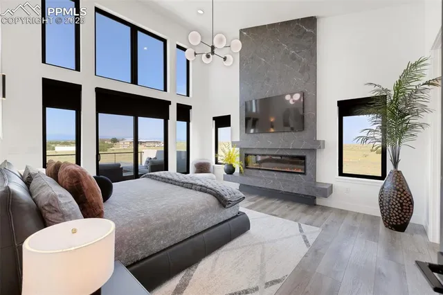 a bedroom with a bed a couch and dresser