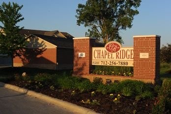 4506 Chapel Ridge Lane Other, IA 51501 - Photo 5 of 11 a sign on the side of a building