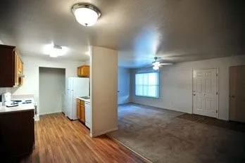 a view of a kitchen cabinets and wooden floor