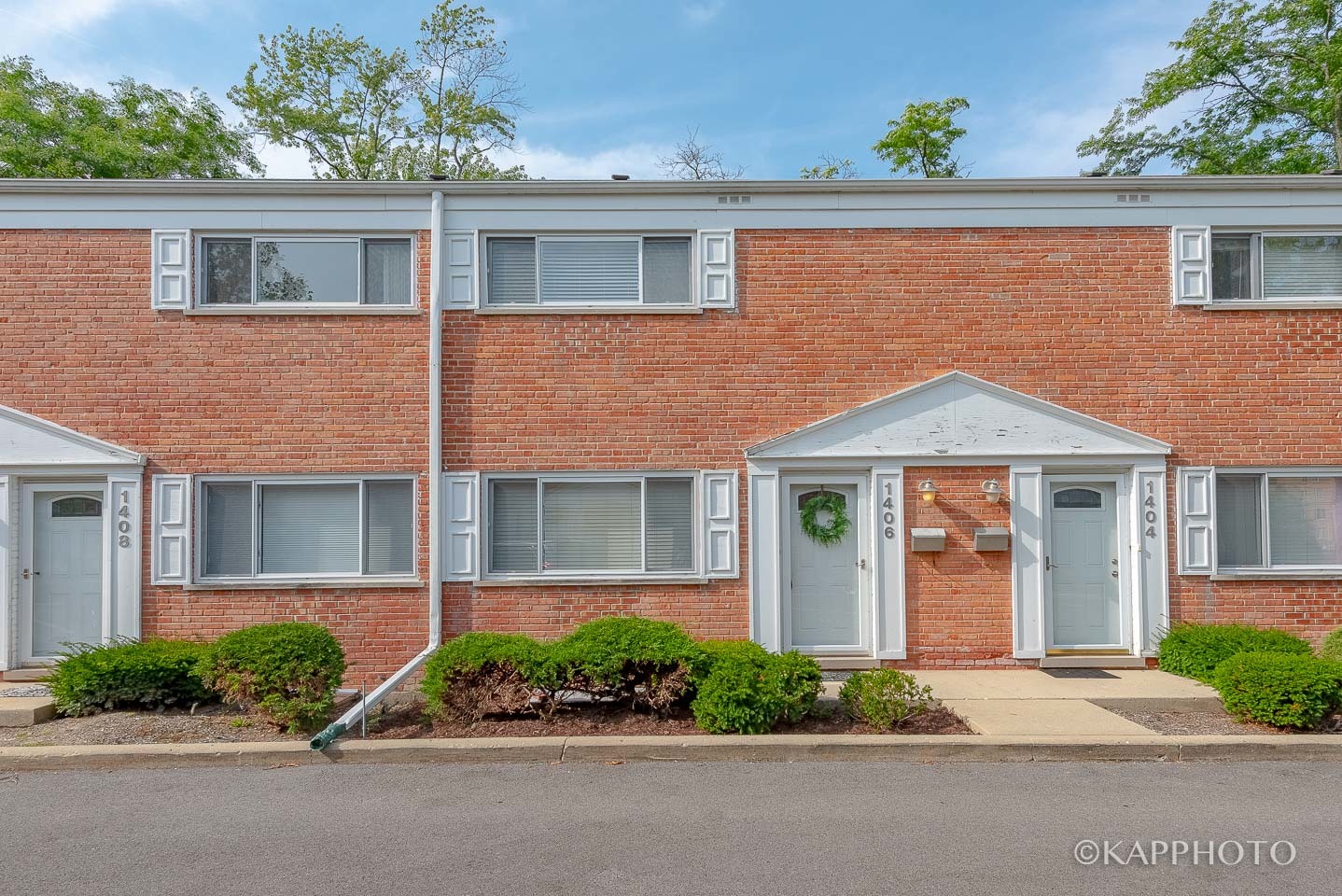 1406 Shermer Road, Unit 1406 Northbrook, IL 60062 - Photo 1 of 28 front view of a house with a garden