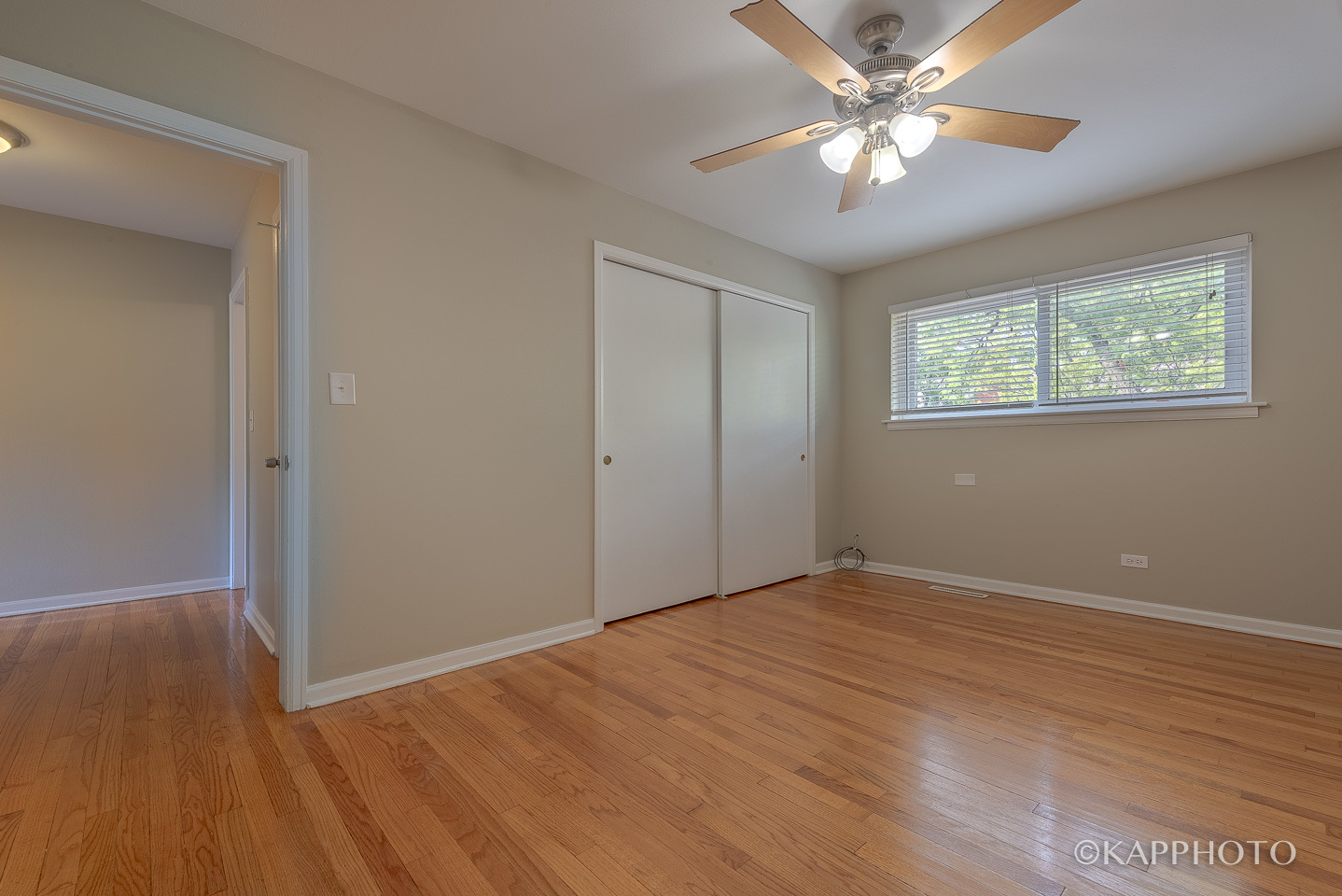 1406 Shermer Road, Unit 1406 Northbrook, IL 60062 - Photo 17 of 28 wooden floor in an empty room with a window
