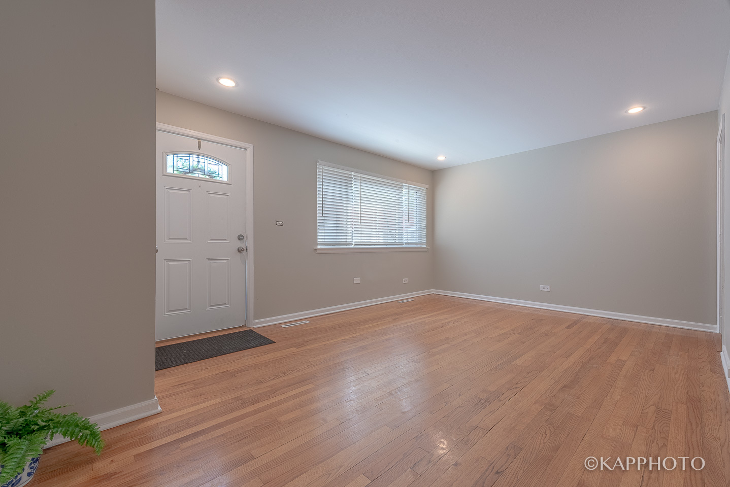 1406 Shermer Road, Unit 1406 Northbrook, IL 60062 - Photo 23 of 28 an empty room with wooden floor and windows