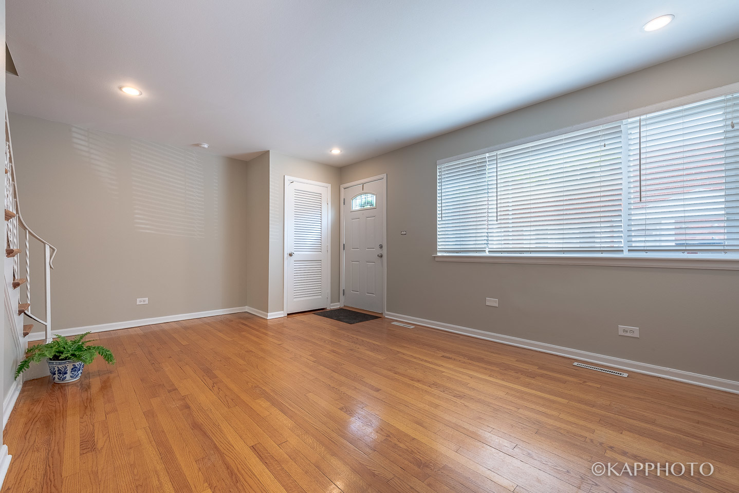 1406 Shermer Road, Unit 1406 Northbrook, IL 60062 - Photo 25 of 28 a view of an empty room with wooden floor and a window