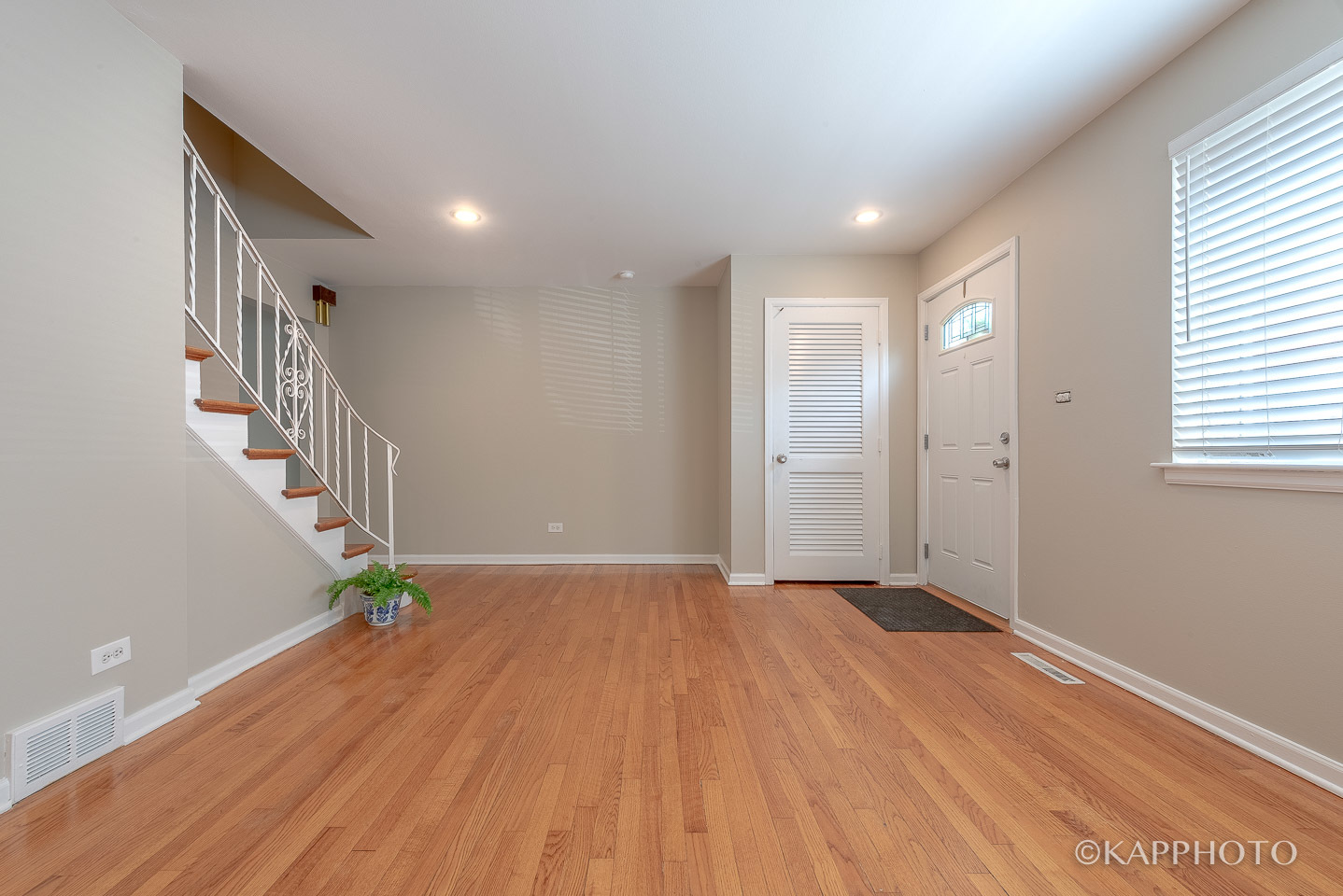 1406 Shermer Road, Unit 1406 Northbrook, IL 60062 - Photo 26 of 28 a view of an empty room with wooden floor and stairs