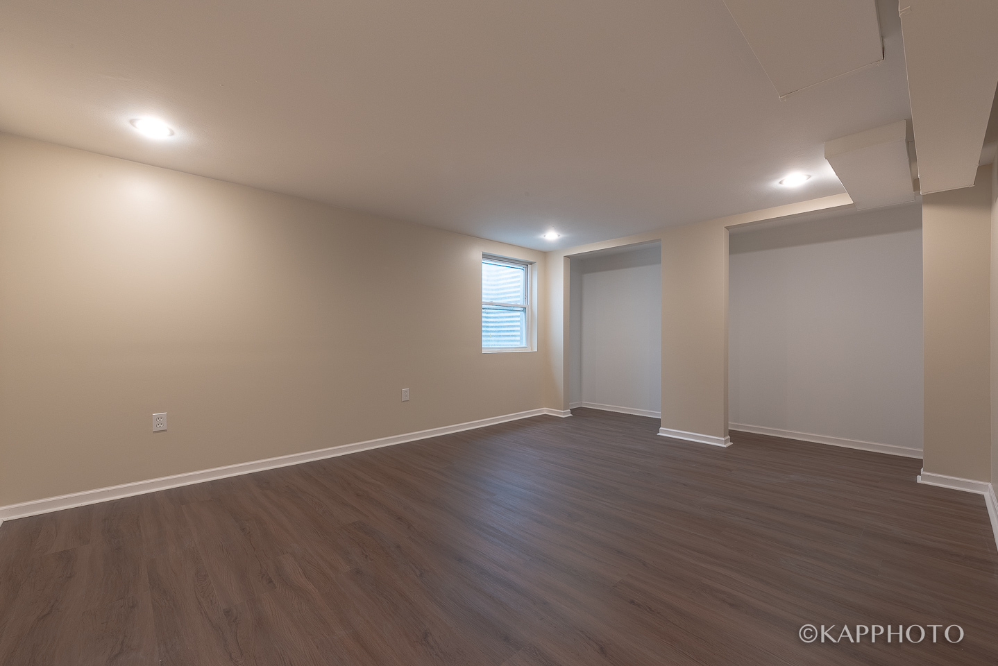 1406 Shermer Road, Unit 1406 Northbrook, IL 60062 - Photo 3 of 28 an empty room with wooden floor and window