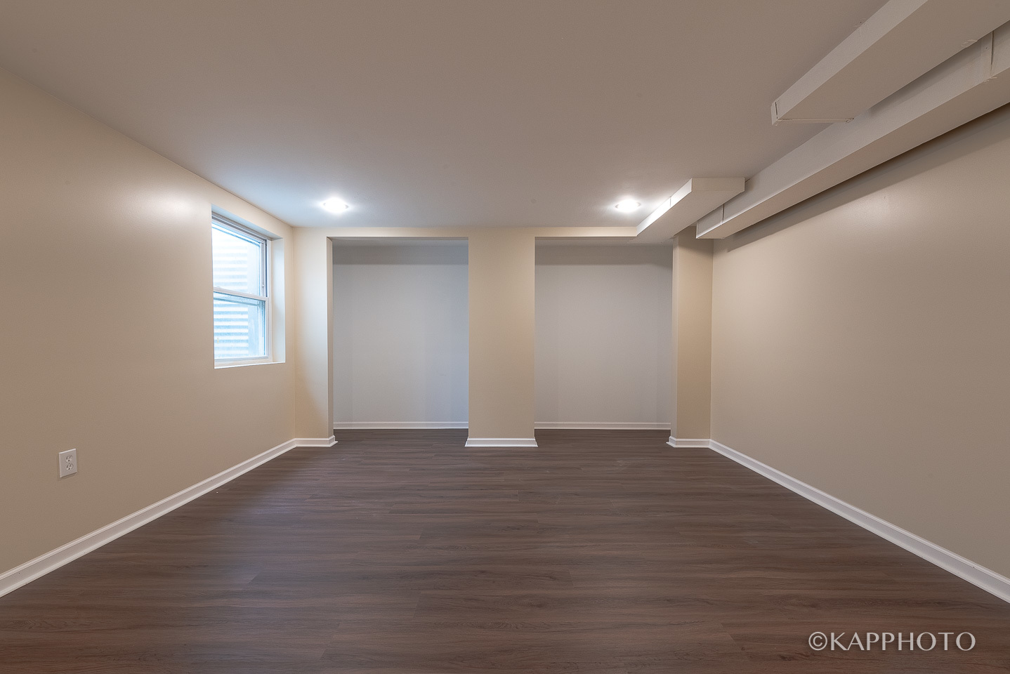 1406 Shermer Road, Unit 1406 Northbrook, IL 60062 - Photo 4 of 28 a view of an empty room with wooden floor and a window