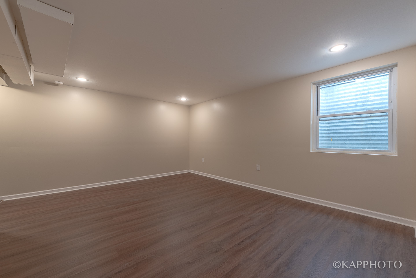 1406 Shermer Road, Unit 1406 Northbrook, IL 60062 - Photo 6 of 28 an empty room with wooden floor and windows