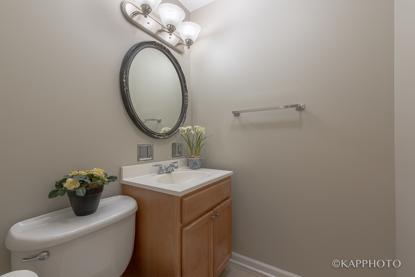 1406 Shermer Road, Unit 1406 Northbrook, IL 60062 - Photo 7 of 28 a bathroom with a toilet sink and mirror