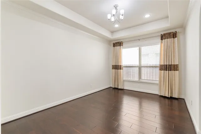 a kitchen with refrigerator and cabinets