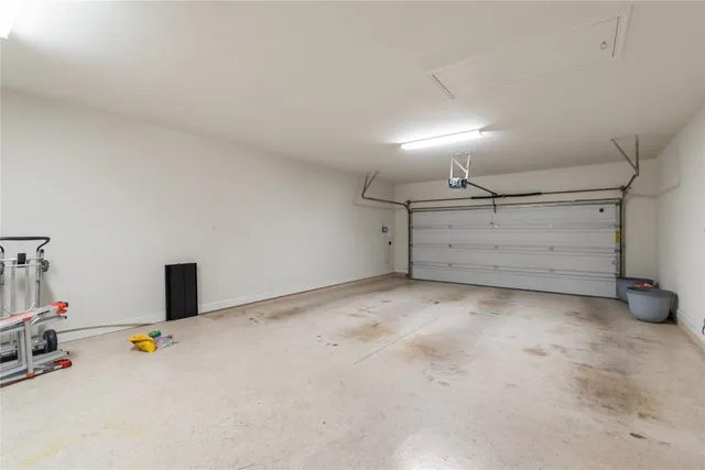 a view of a livingroom with a ceiling fan and window