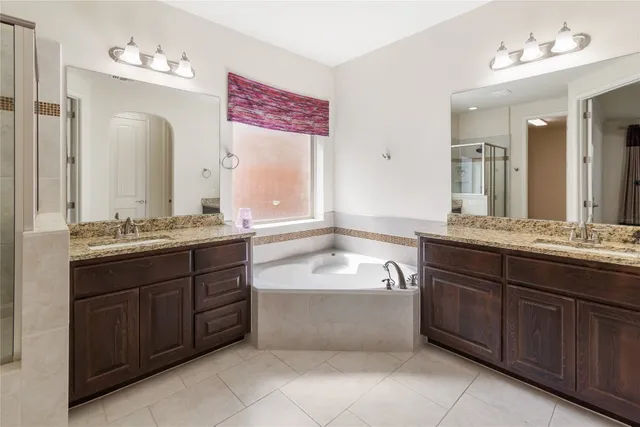 an empty room with closet and a chandelier fan