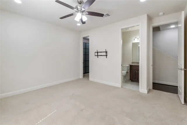 a bathroom with a granite countertop sink double and mirror