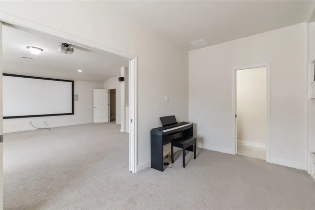 a view of an outdoor dining space with a table and chairs