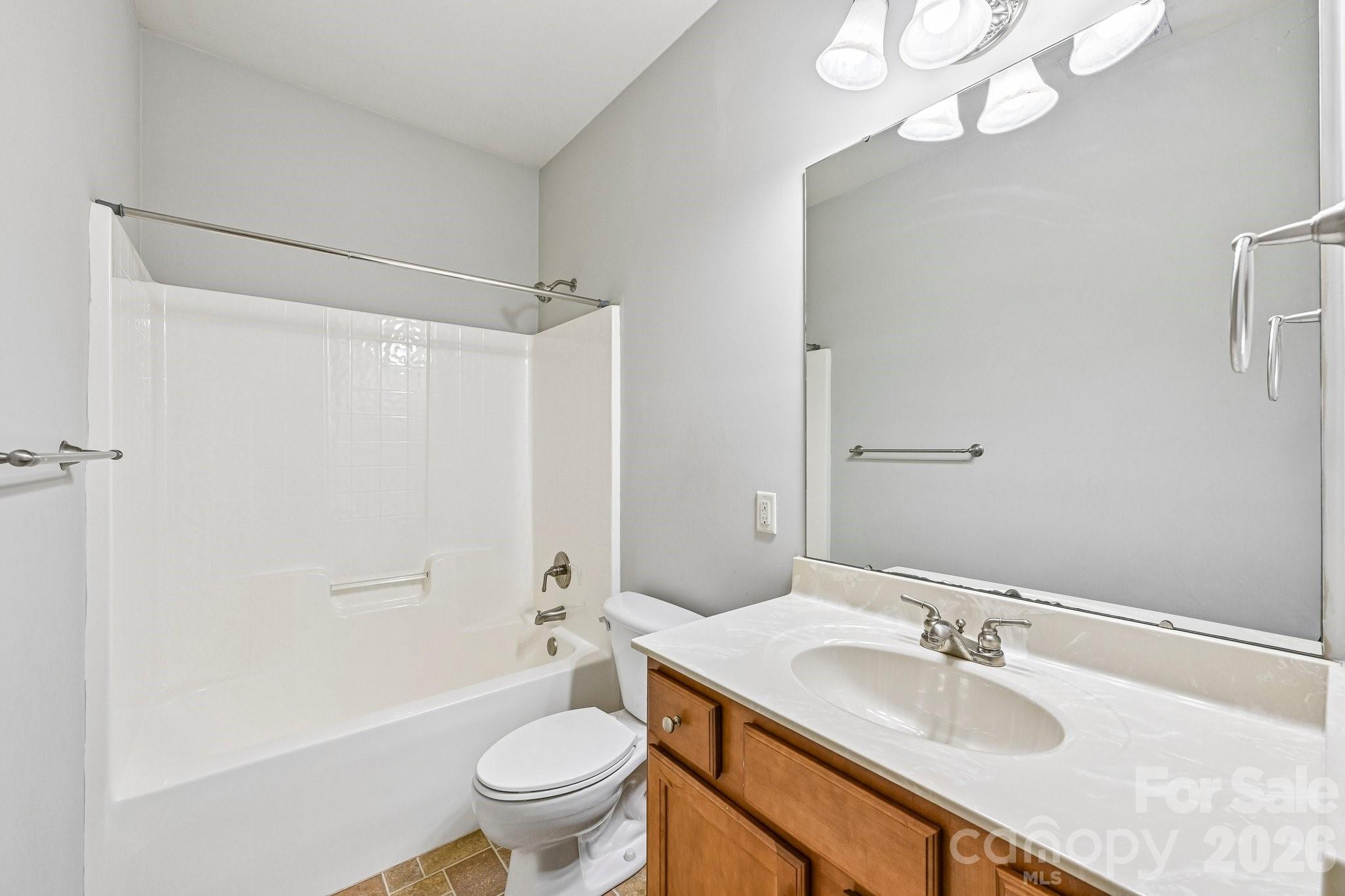 624 Hunley Street Monroe, NC 28112 - Photo 24 of 36 a bathroom with a sink a toilet and shower