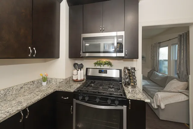 a kitchen with a stove and a microwave