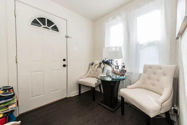 a view of a livingroom with furniture and a table
