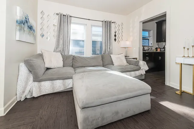 a living room with furniture and a large window