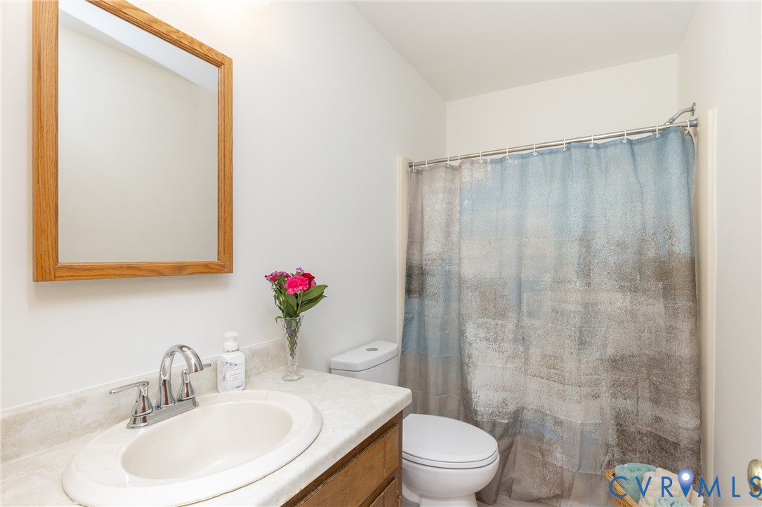 617 Rebel Ridge Road Colonial Heights, VA 23834 - Photo 27 of 49 a bathroom with a sink toilet and shower