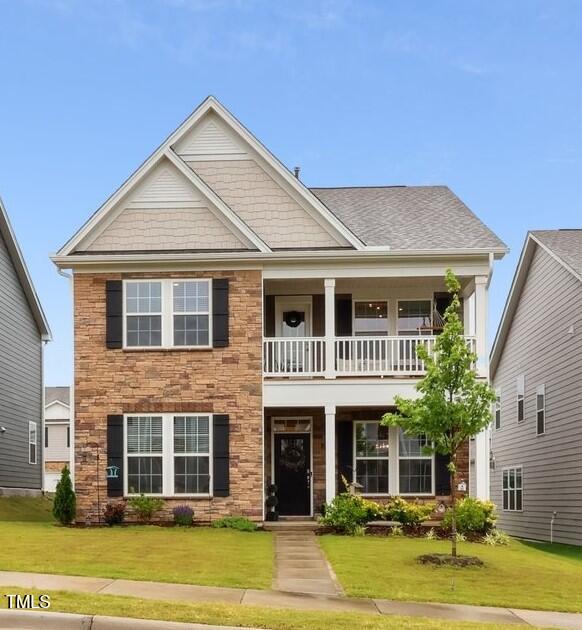 817 James J Freeland Memorial Drive Hillsborough, NC 27278 - Photo 1 of 33 a front view of a house with a garden