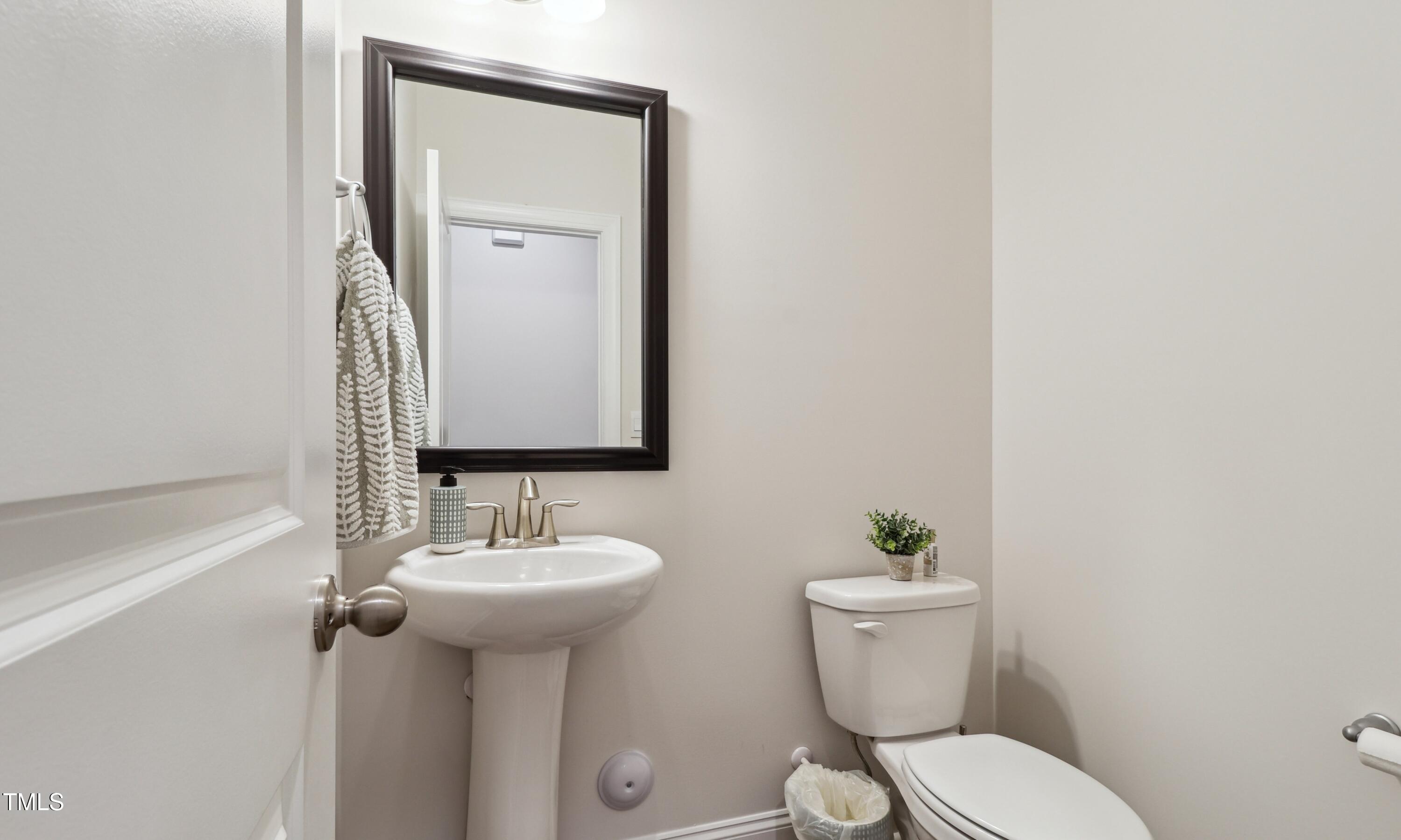 817 James J Freeland Memorial Drive Hillsborough, NC 27278 - Photo 9 of 33 a bathroom with a toilet sink and mirror