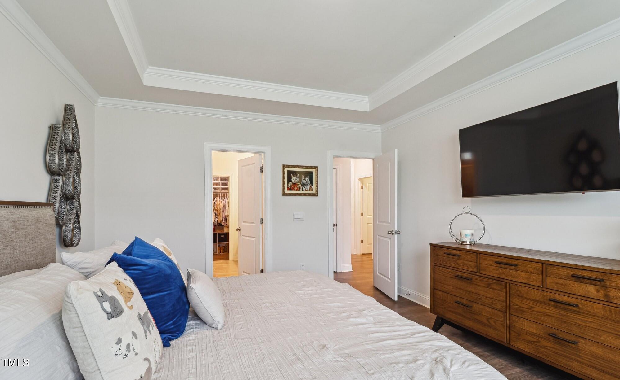 817 James J Freeland Memorial Drive Hillsborough, NC 27278 - Photo 11 of 33 a bedroom with a bed and a flat screen tv