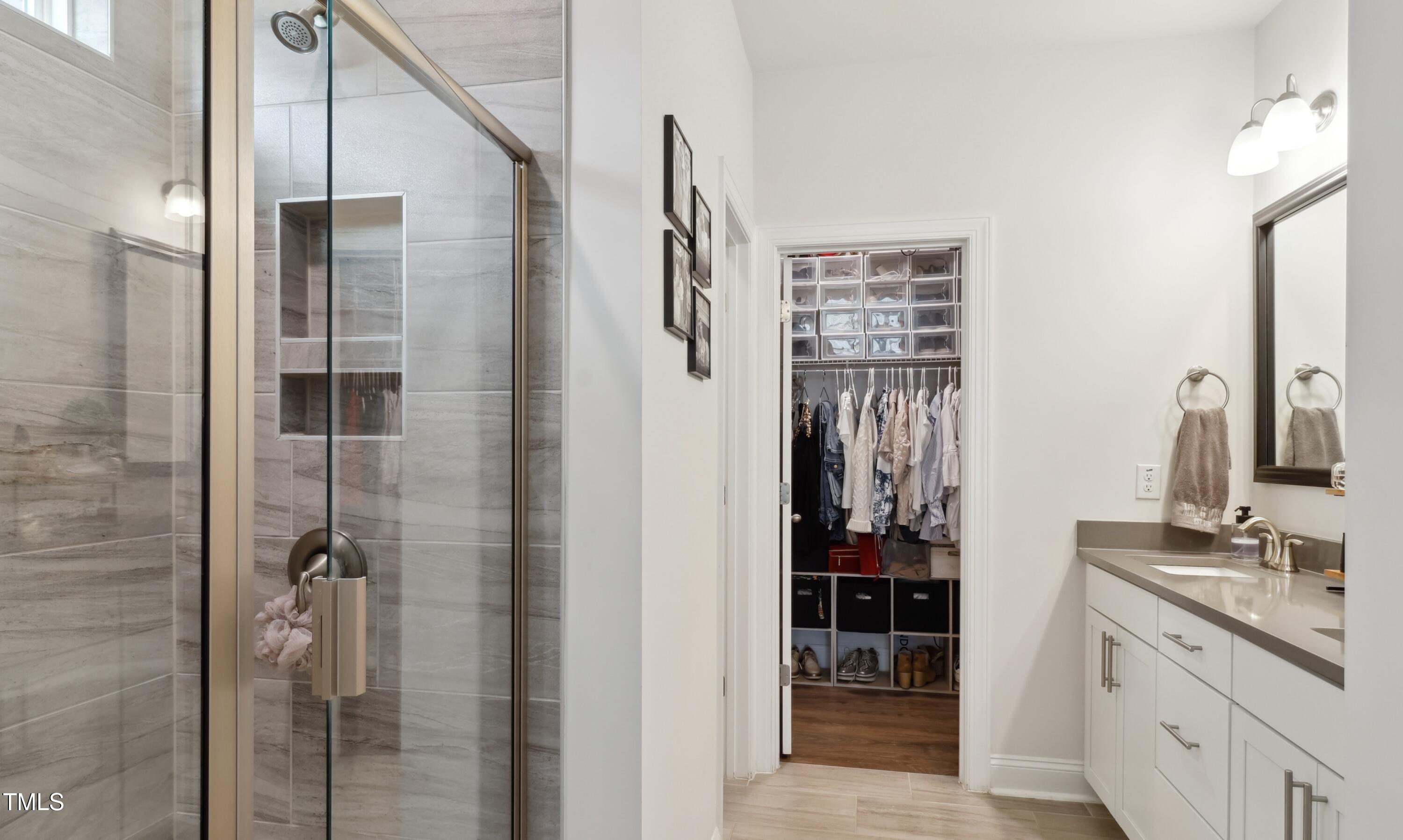 817 James J Freeland Memorial Drive Hillsborough, NC 27278 - Photo 12 of 33 a bathroom with a double vanity sink and mirror