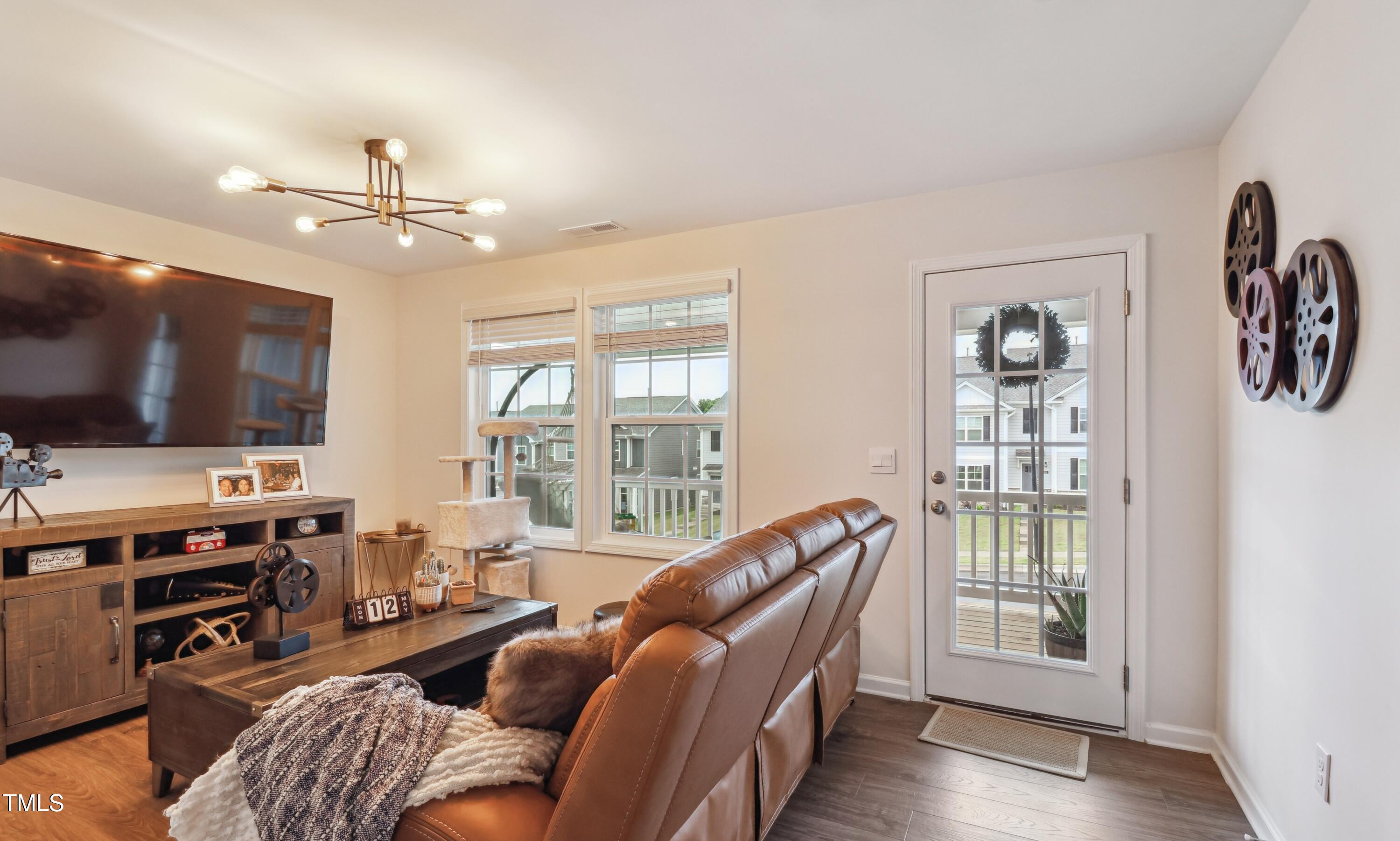 817 James J Freeland Memorial Drive Hillsborough, NC 27278 - Photo 17 of 33 a living room with furniture and a flat screen tv