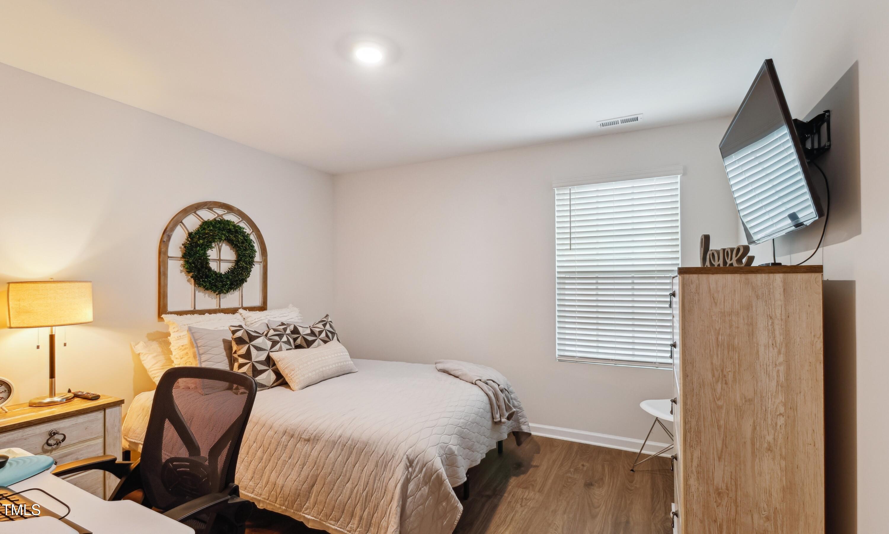 817 James J Freeland Memorial Drive Hillsborough, NC 27278 - Photo 18 of 33 a bedroom with a bed and a window