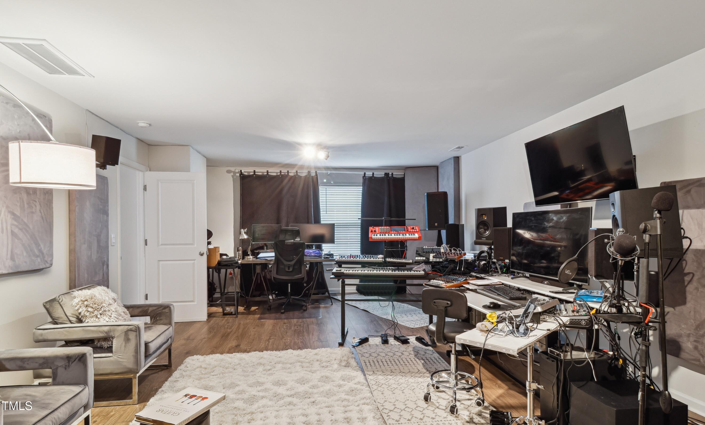 817 James J Freeland Memorial Drive Hillsborough, NC 27278 - Photo 20 of 33 a living room with furniture and a flat screen tv