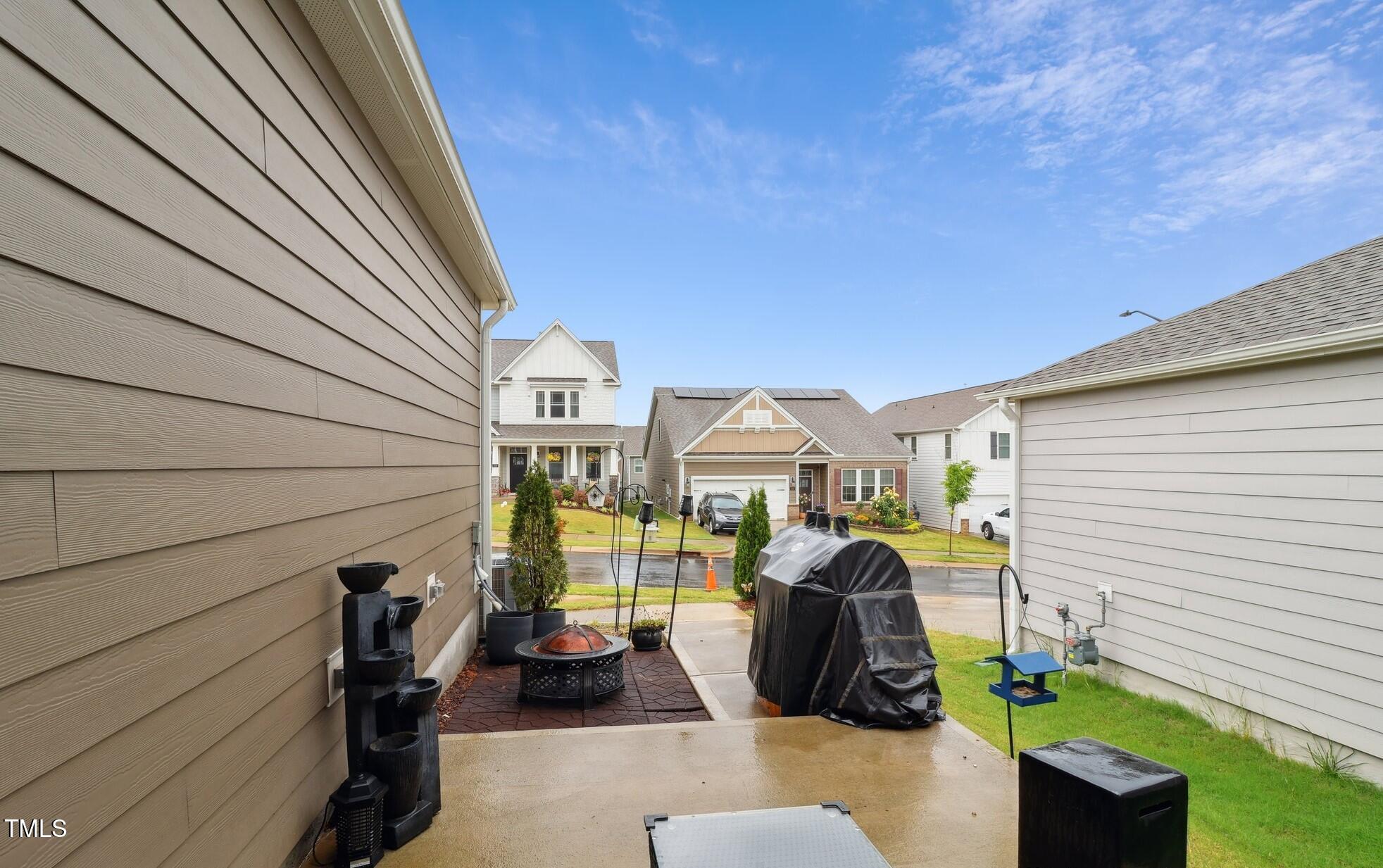 817 James J Freeland Memorial Drive Hillsborough, NC 27278 - Photo 21 of 33 a view of a patio with couches chairs and a potted plant