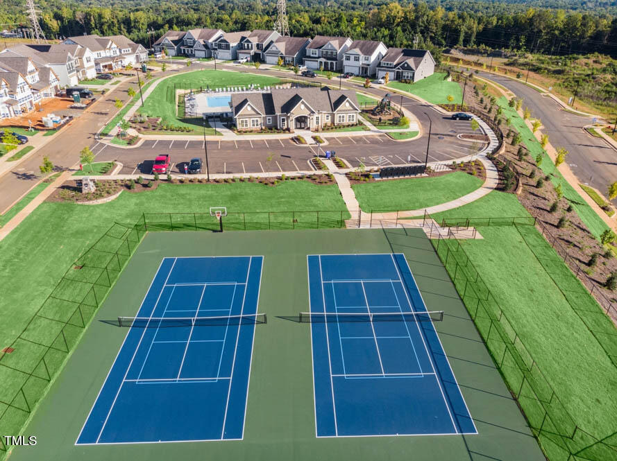 817 James J Freeland Memorial Drive Hillsborough, NC 27278 - Photo 26 of 33 an aerial view of a tennis ground with large trees
