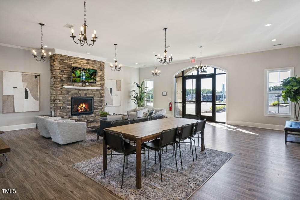 817 James J Freeland Memorial Drive Hillsborough, NC 27278 - Photo 31 of 33 a view of a dining room with furniture window and wooden floor