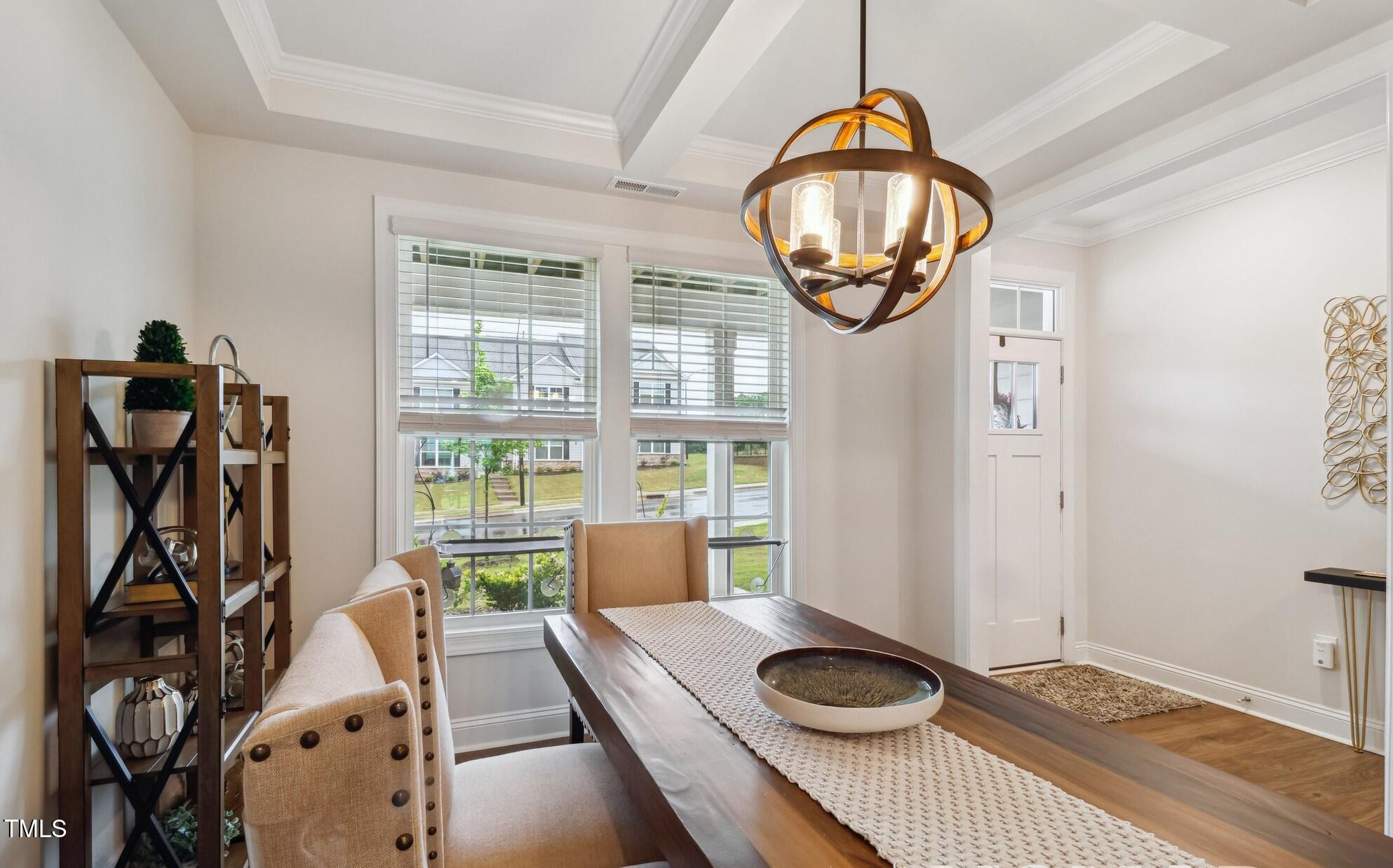 817 James J Freeland Memorial Drive Hillsborough, NC 27278 - Photo 2 of 33 a very nice looking room with a large window and a chandelier