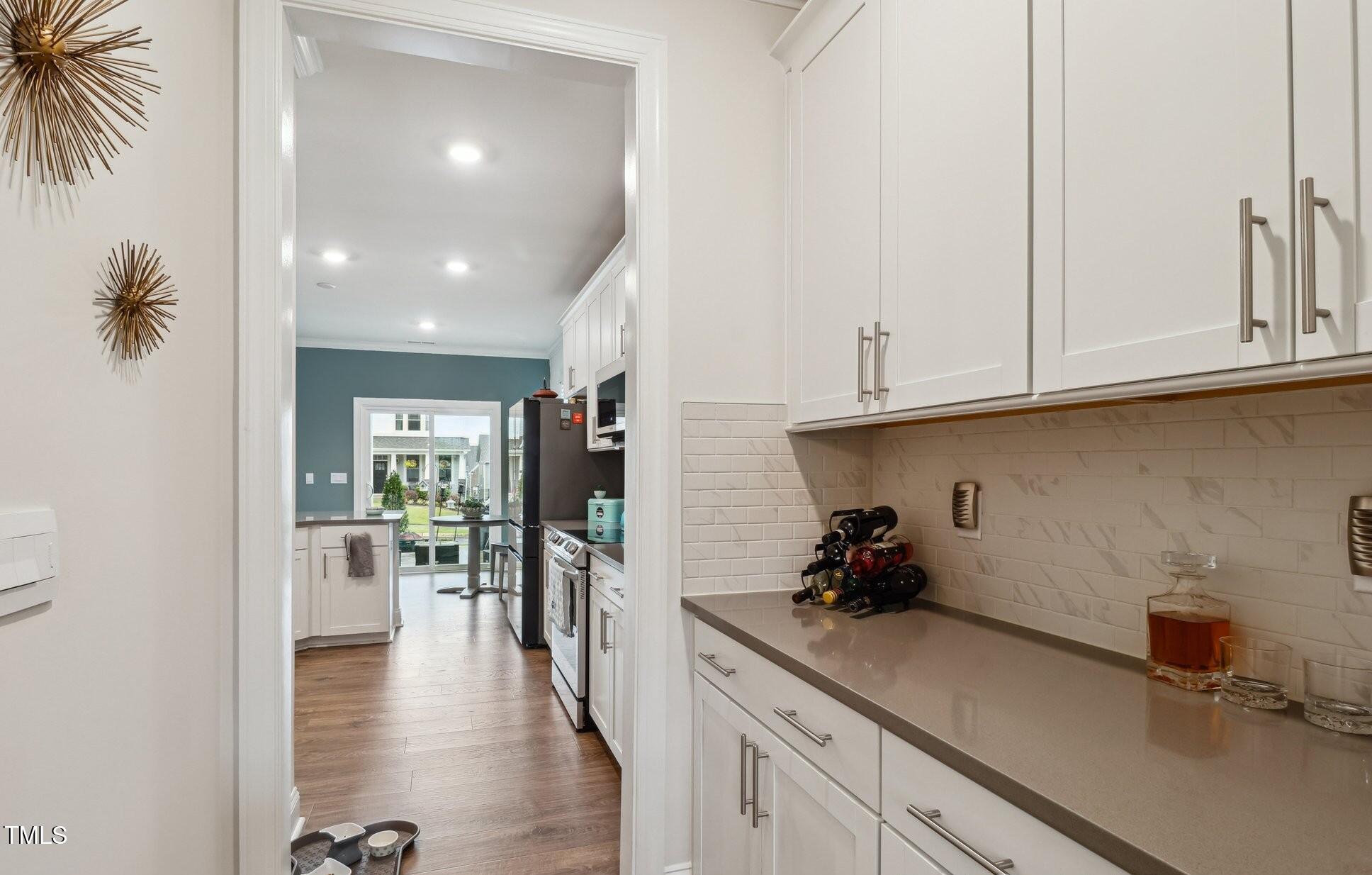 817 James J Freeland Memorial Drive Hillsborough, NC 27278 - Photo 3 of 33 a kitchen with a sink and cabinets