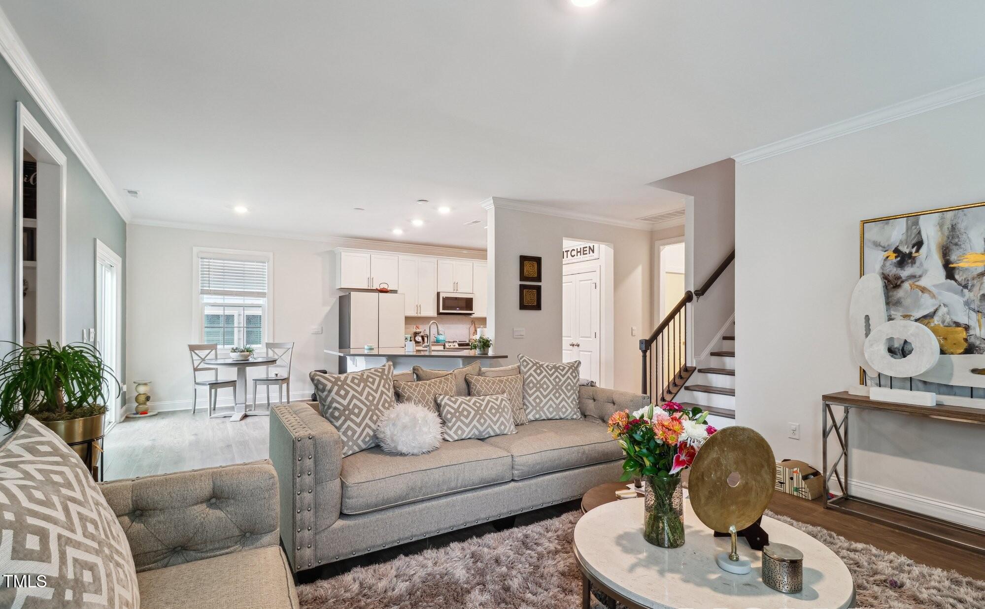 817 James J Freeland Memorial Drive Hillsborough, NC 27278 - Photo 7 of 33 a living room with furniture and a potted plant