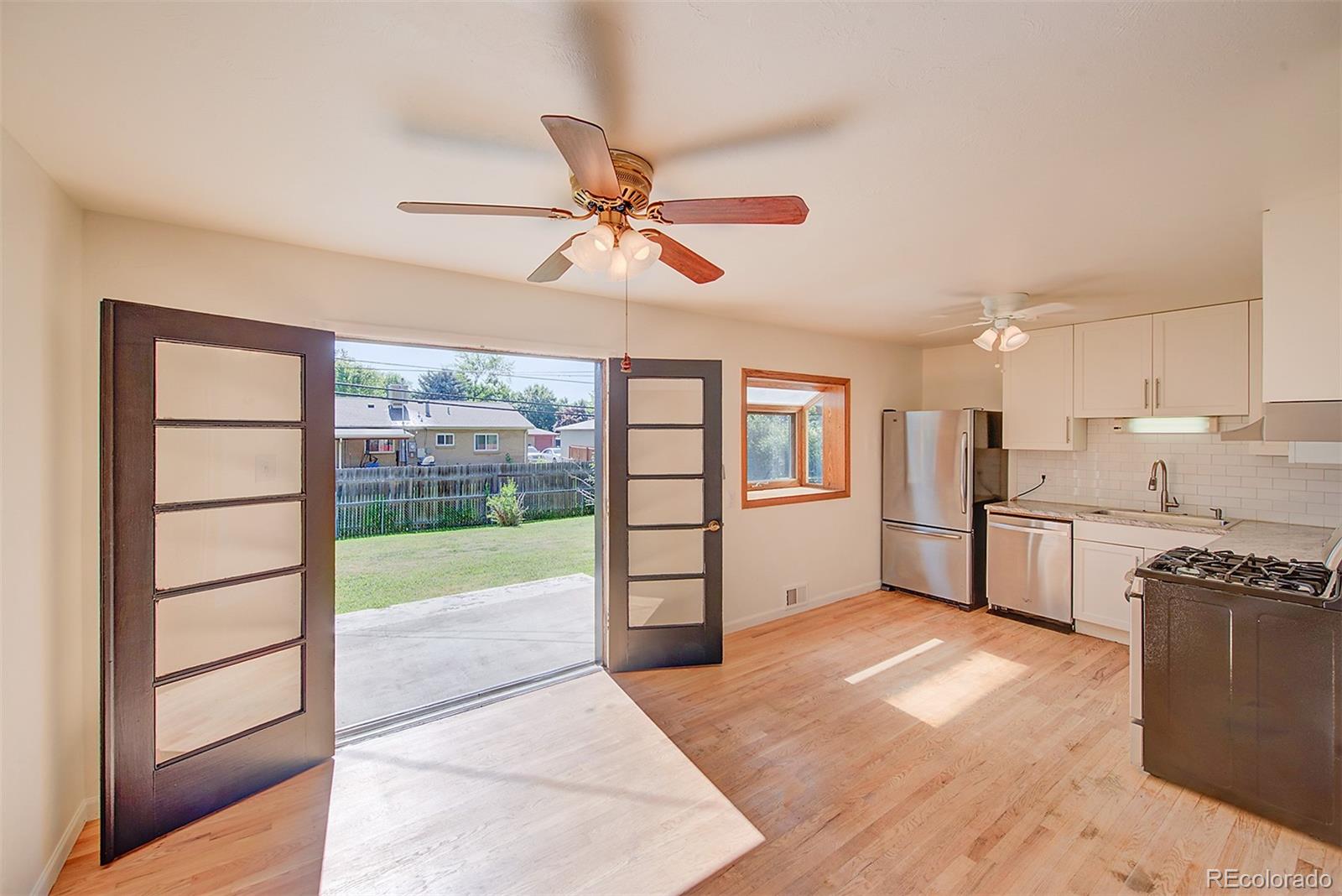 6054 Iris Way Arvada, CO 80004 - Photo 14 of 44 a view of a kitchen with a sink and a window