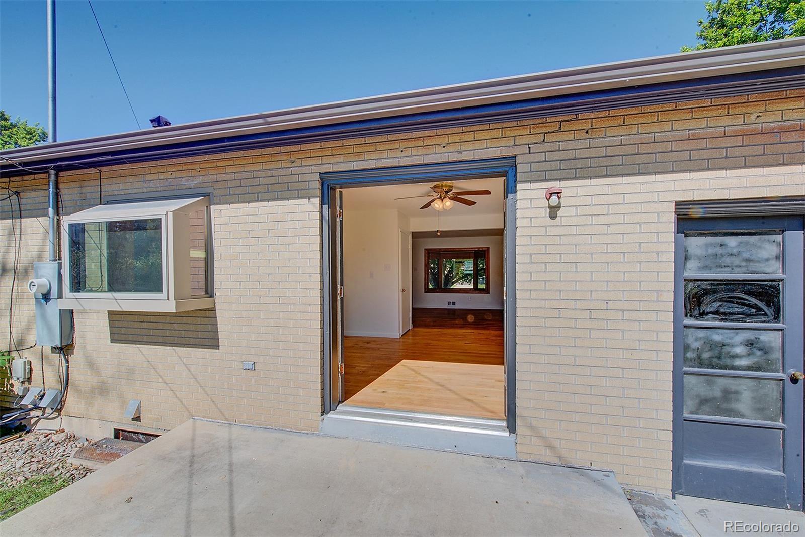 6054 Iris Way Arvada, CO 80004 - Photo 15 of 44 a view of a door and chair