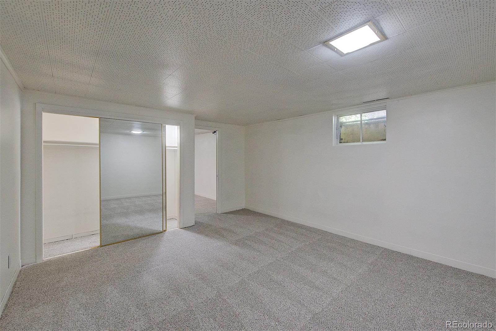 6054 Iris Way Arvada, CO 80004 - Photo 30 of 44 an empty room with an entryway